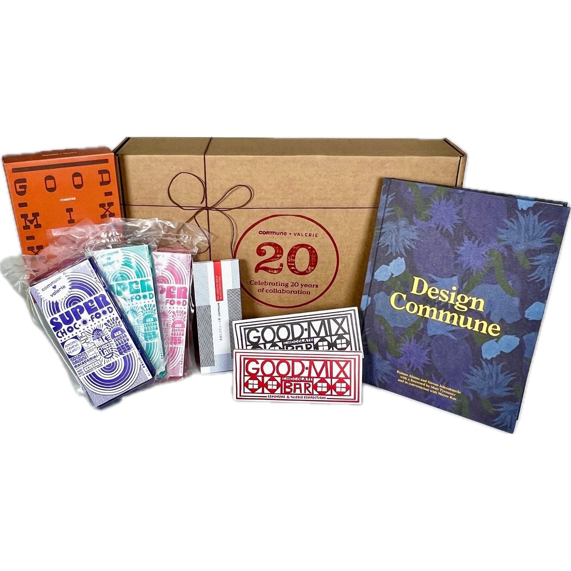A curated Commune Gift Set featuring the Commune Design Book, artisanal chocolate bars, and elegantly packaged confections by Valerie Confections, celebrating 20 years of collaboration.