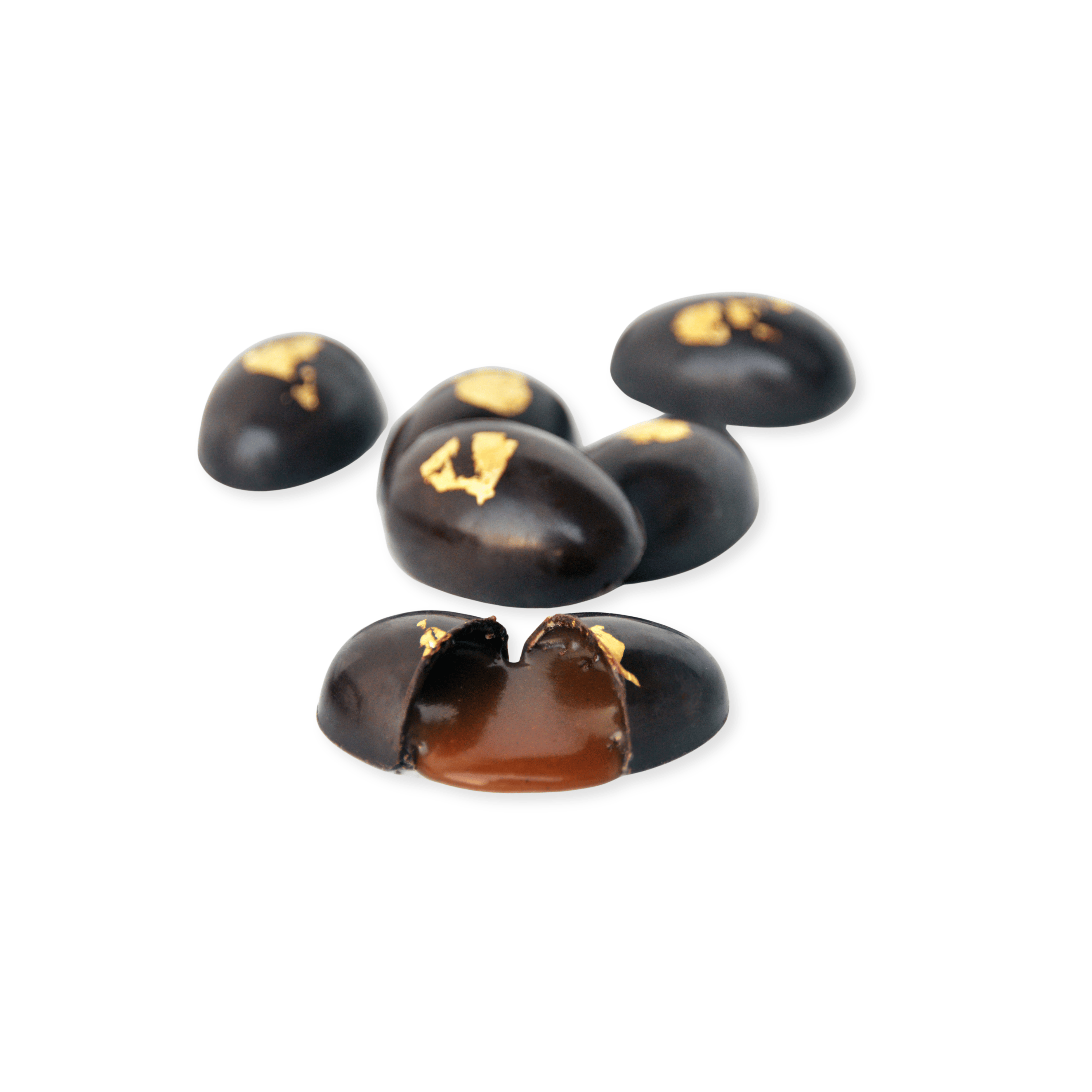 Dark chocolate eggs with gold accents on a white background