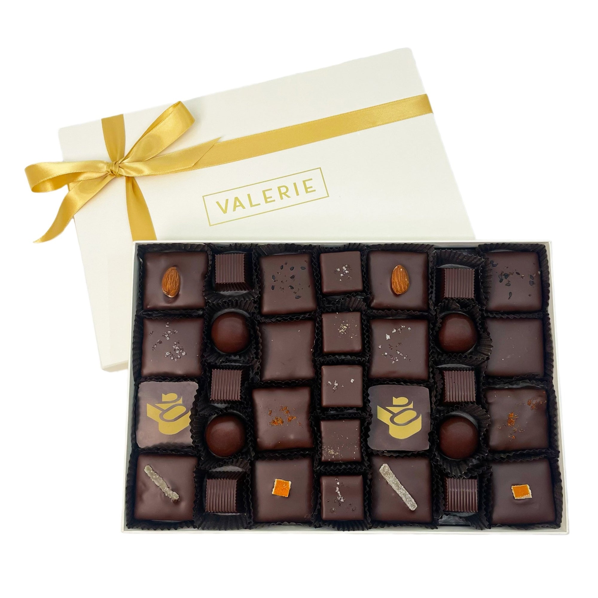 A selection of Valerie Confections’ Grand Assortment chocolates, featuring handcrafted truffles, toffees, and caramels in a beautifully arranged gift box.