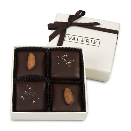 2 pieces of Almond Fleur de Sel and 2 pieces Almond chocolate covered toffees, in a small ivory Valerie box with thin chocolate brown satin ribbon.
