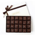 A 24-piece box of Almond Fleur de Sel Toffee, featuring premium bittersweet chocolate and organic almonds, elegantly packaged with a brown satin ribbon.