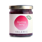 A 7-ounce jar of Blushing Berry Jam by Valerie Confections, featuring a minimalist label with a soft pink and red design. Made in small batches with fresh, locally sourced berries for a bright, naturally sweet flavor.