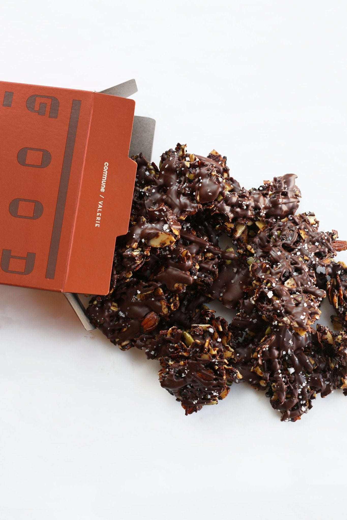 Crunchy chocolate clusters made with almonds, pumpkin seeds, and sea salt, drizzled with bittersweet chocolate.
