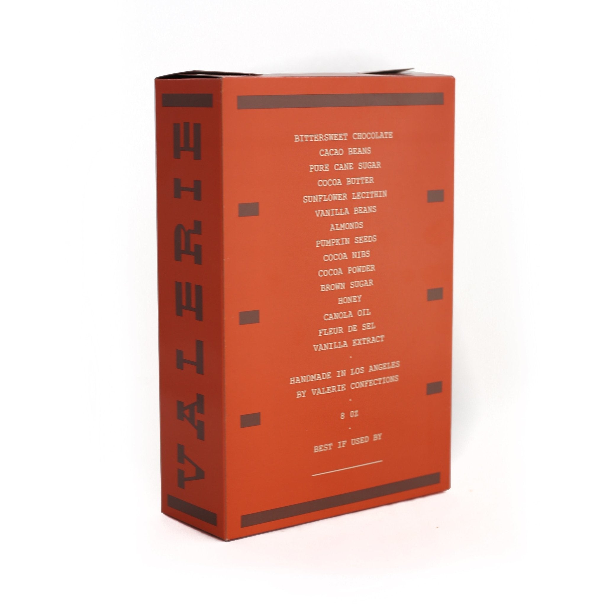 An orange Good Mix box featuring an ingredient list with premium chocolate, nuts, and seeds.