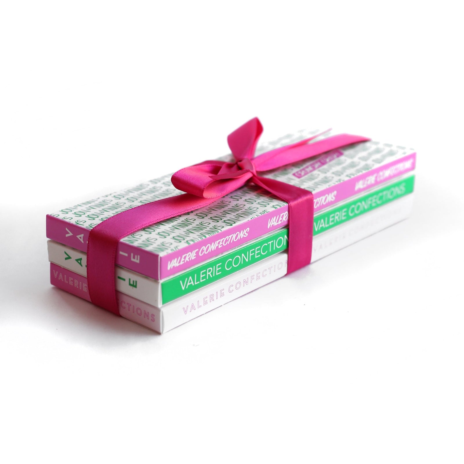 A beautifully wrapped trio of Jon & Vinny and Helen and Valerie chocolate bars, tied together with a pink satin ribbon, making a perfect gift set.