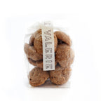 A clear bag of Valerie Confections’ Malted Shortbread Cookies, sealed with a signature label. These buttery, toasty treats make the perfect gift or indulgence.