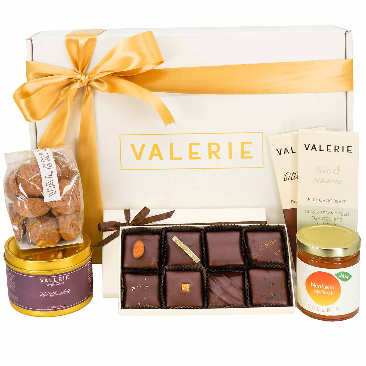 Gourmet gift box containing an assortment of Valerie brand chocolate, cookies, hot chocolate, and apricot jam.