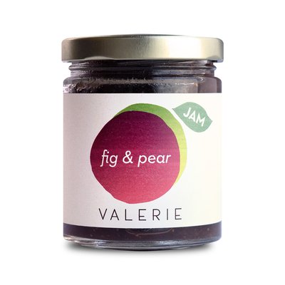 A jar of fig and pear jam with a gold lid and a label reading "fig & pear, VALERIE."